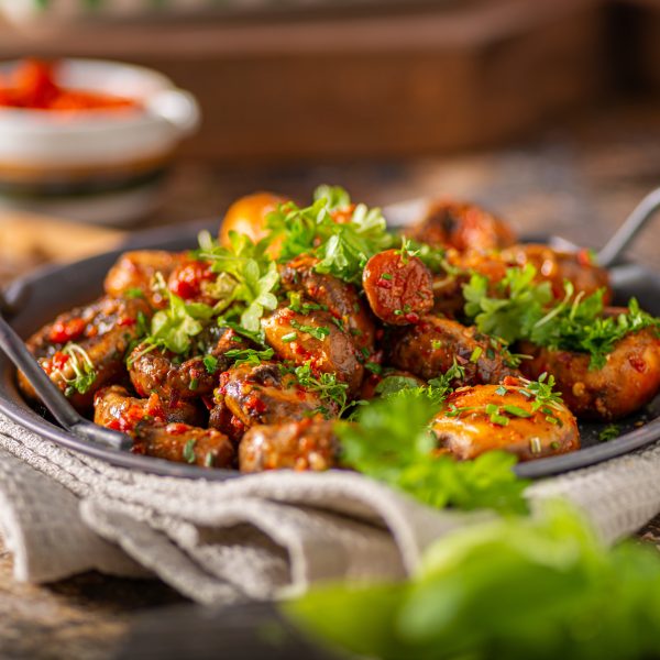Roasted mushrooms and chilli sauce topped with herbs